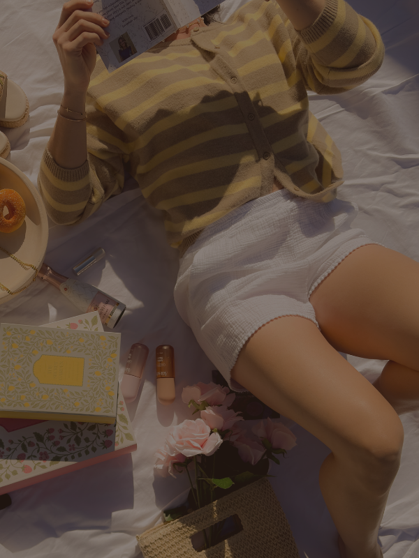 Summer outfit ideas 2026 featuring a striped cardigan styled with white shorts in a soft feminine aesthetic