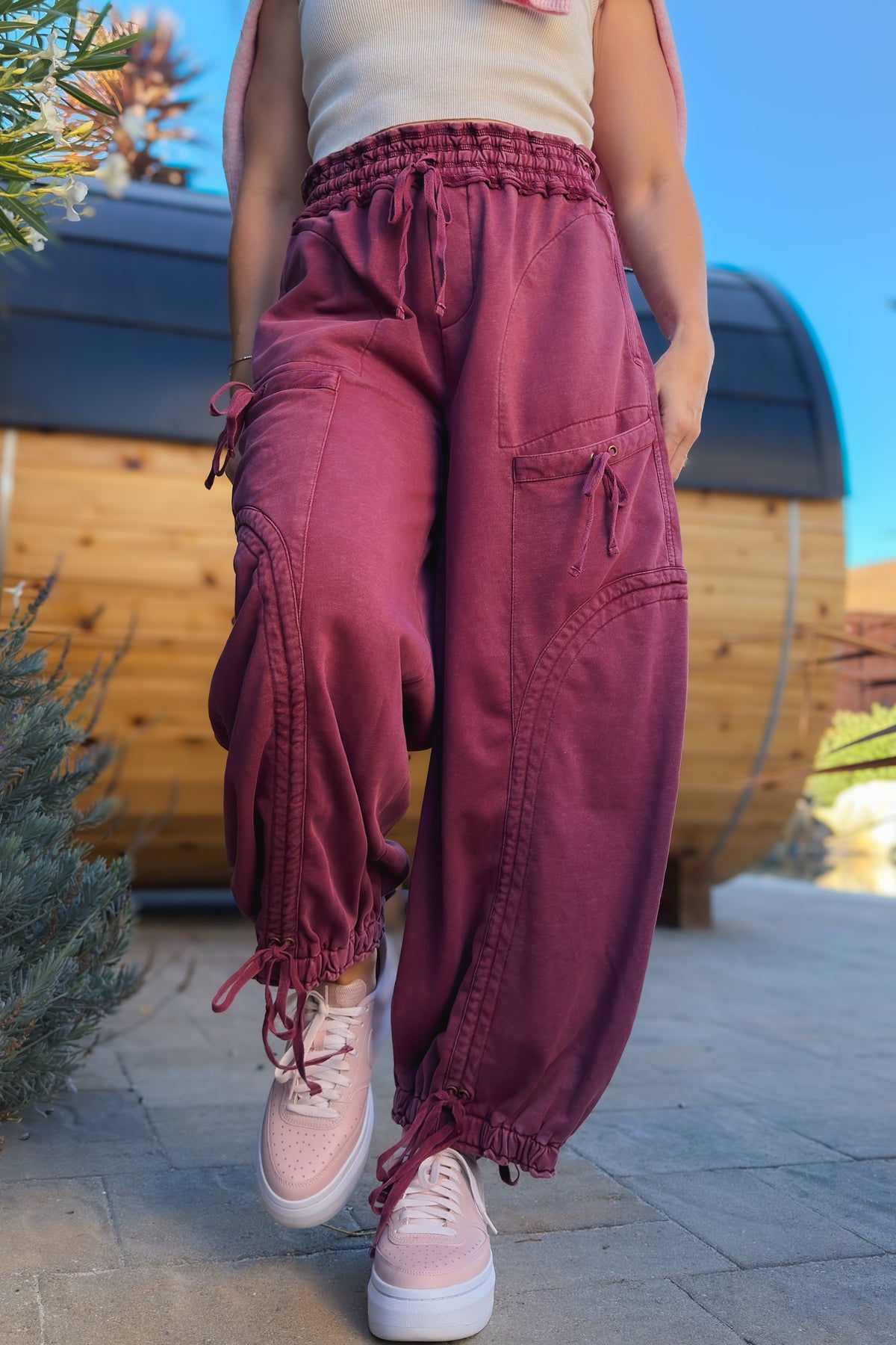 1. Relaxed burgundy mineral wash utility pants with wide leg silhouette and high elastic waist