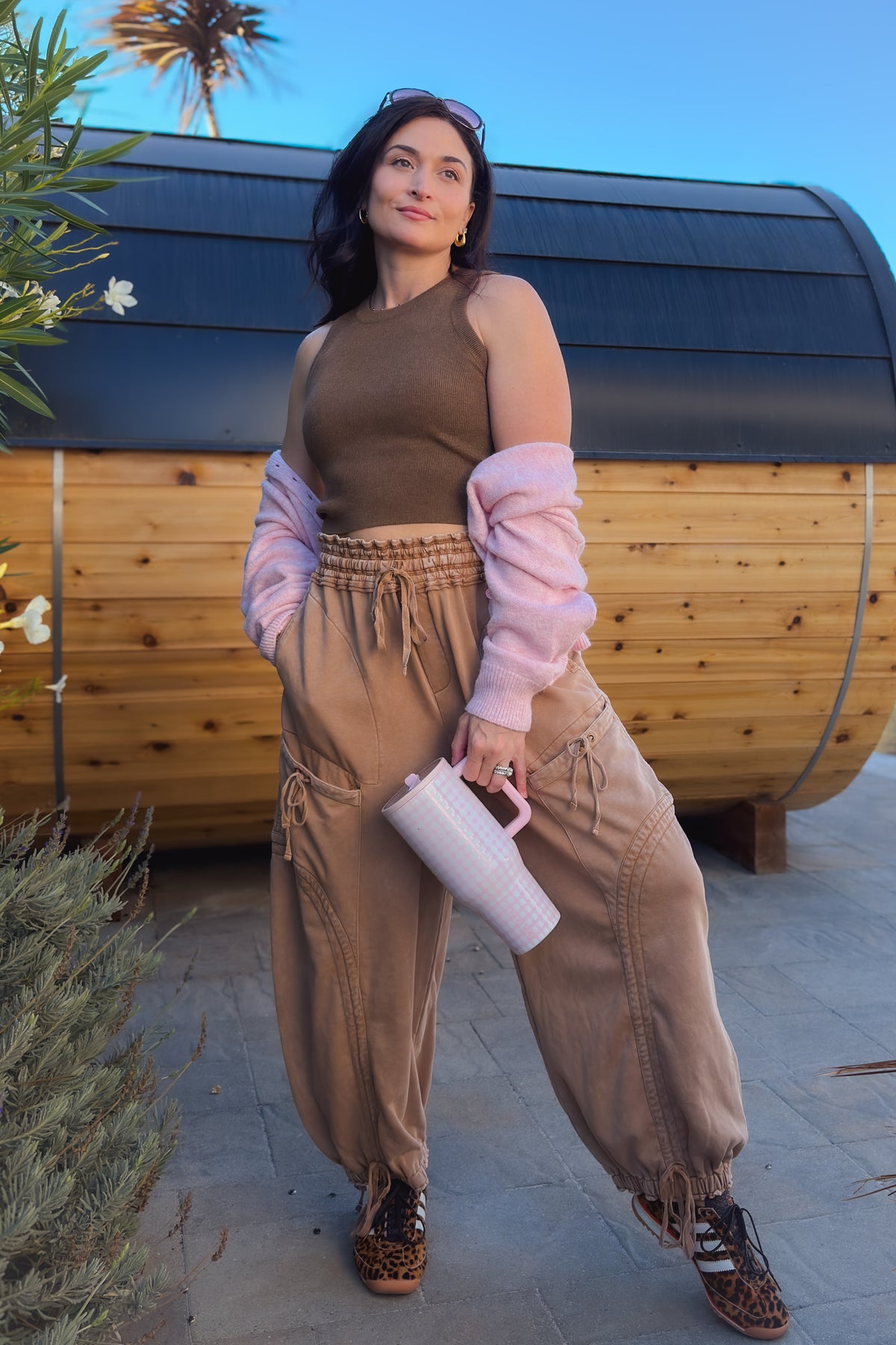Tan wide leg utility pants with adjustable ankle ties and garment-dyed mineral wash finish