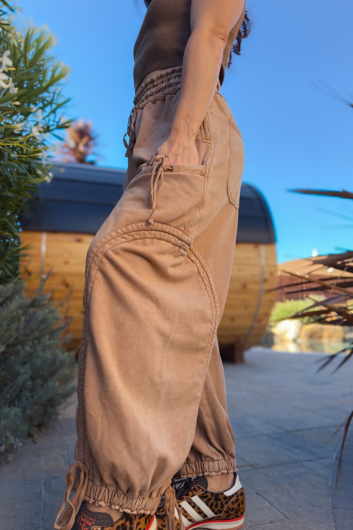 Women’s tan balloon-style cargo pants with relaxed fit and cinchable ankles