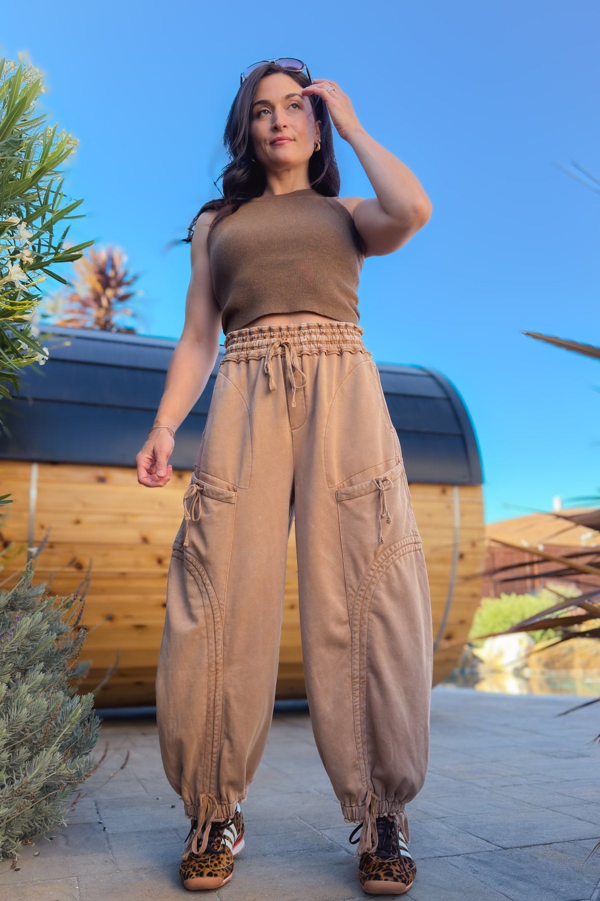 Back view of tan mineral wash cargo pants with functional patch pockets and wide leg fit