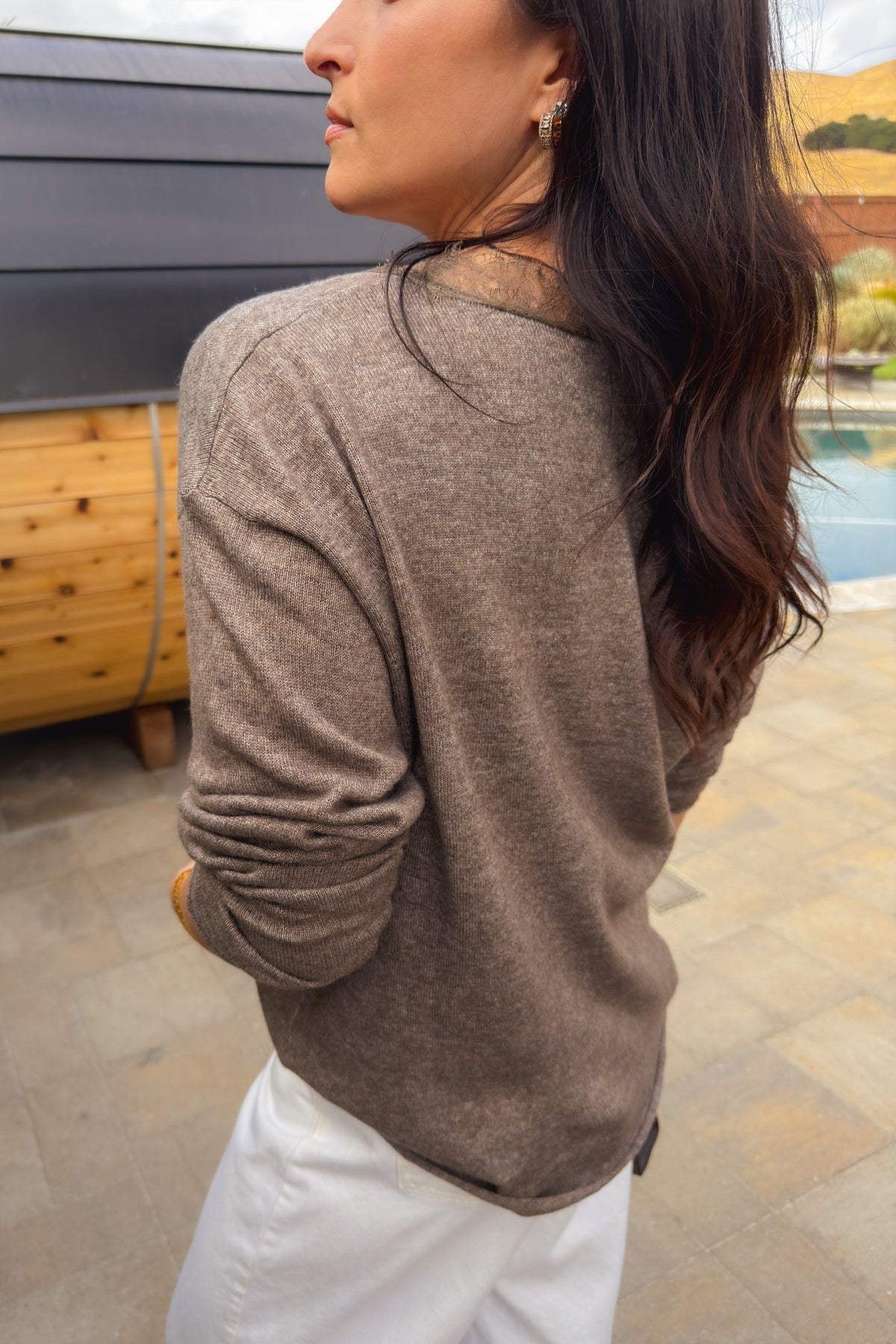 Soft oversized V-neck sweater in taupe brown with delicate feminine lace detail