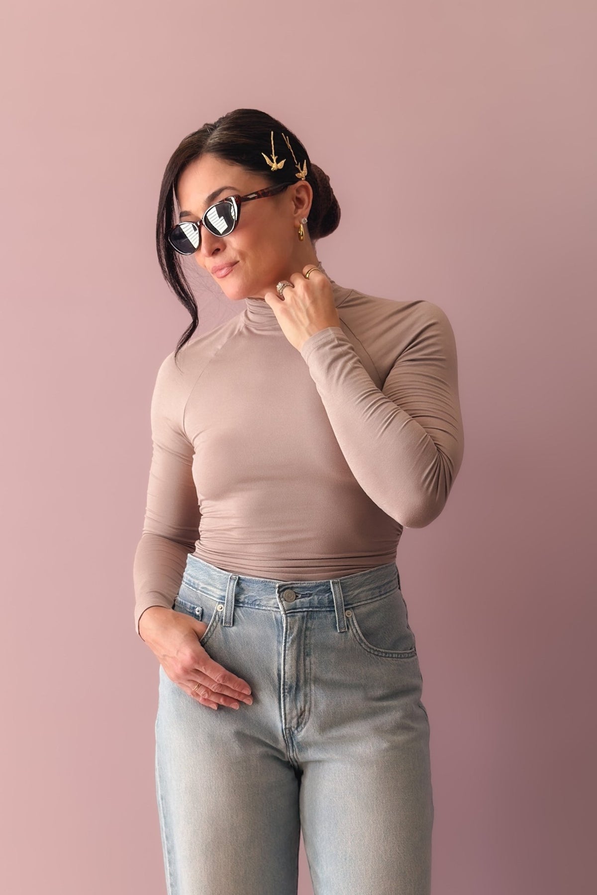 Neutral taupe fitted top with open back detail and long sleeves