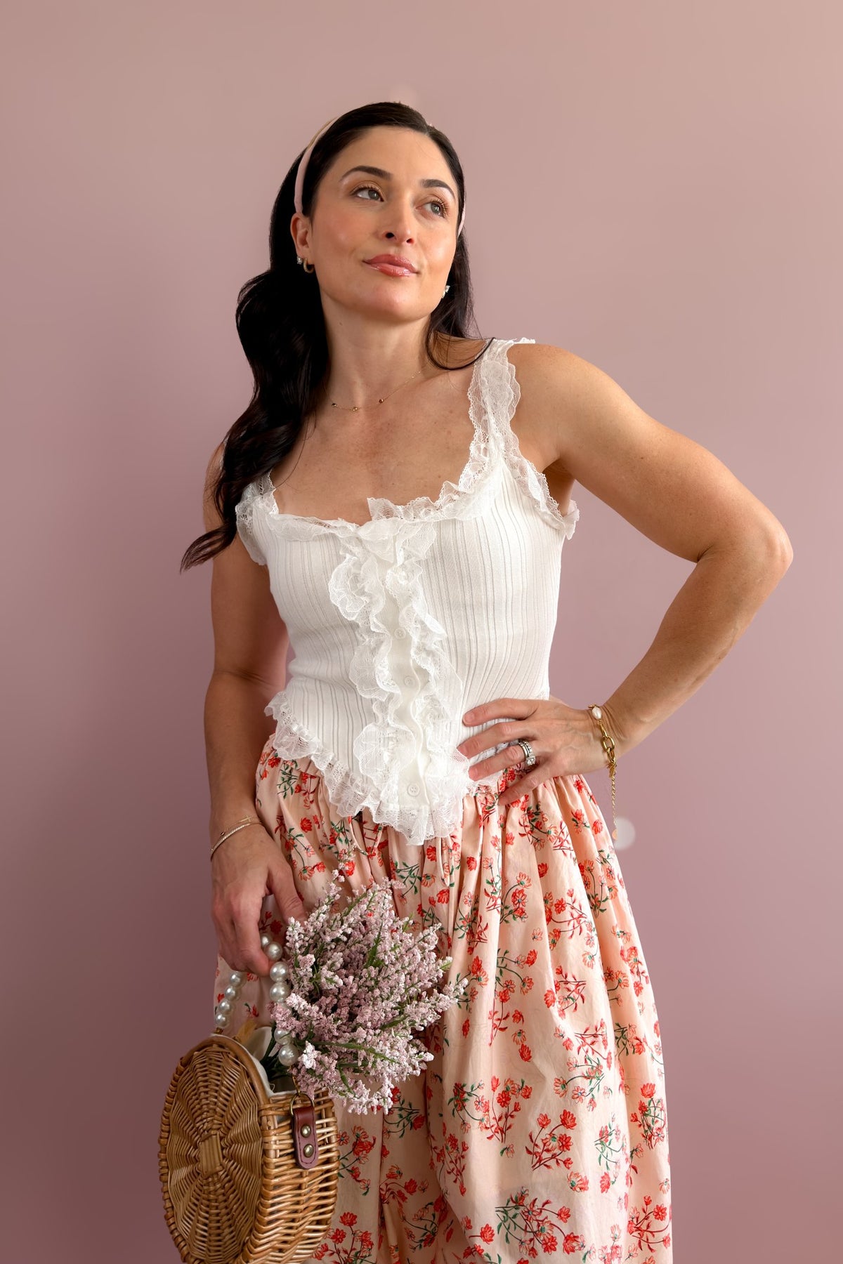 Close-up of white ruffle lace tank showing the ribbed knit, covered buttons, and delicate lace detailing