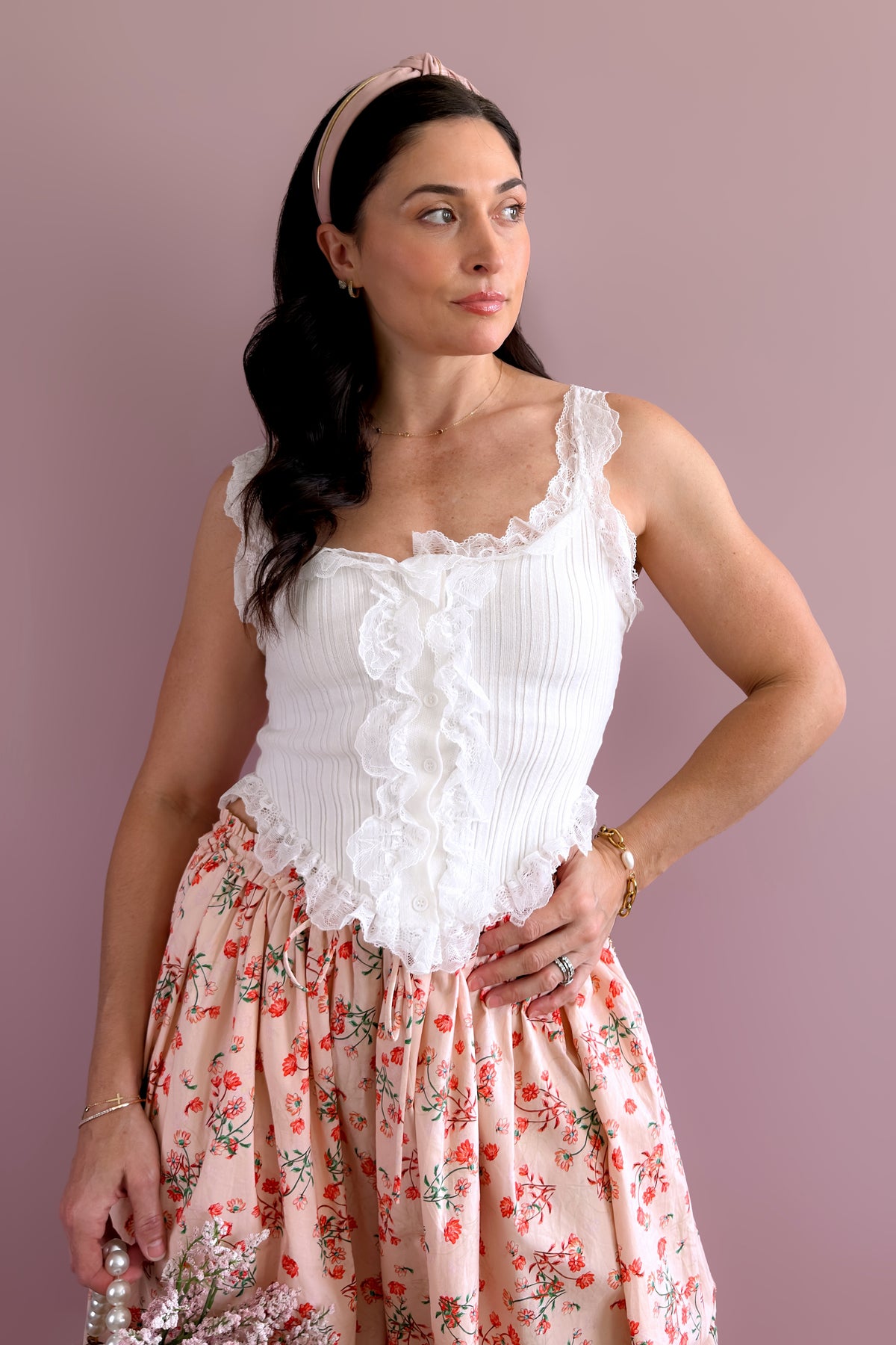 Women’s white lace trim tank top with soft ribbed texture and delicate ruffles along the neckline and hem