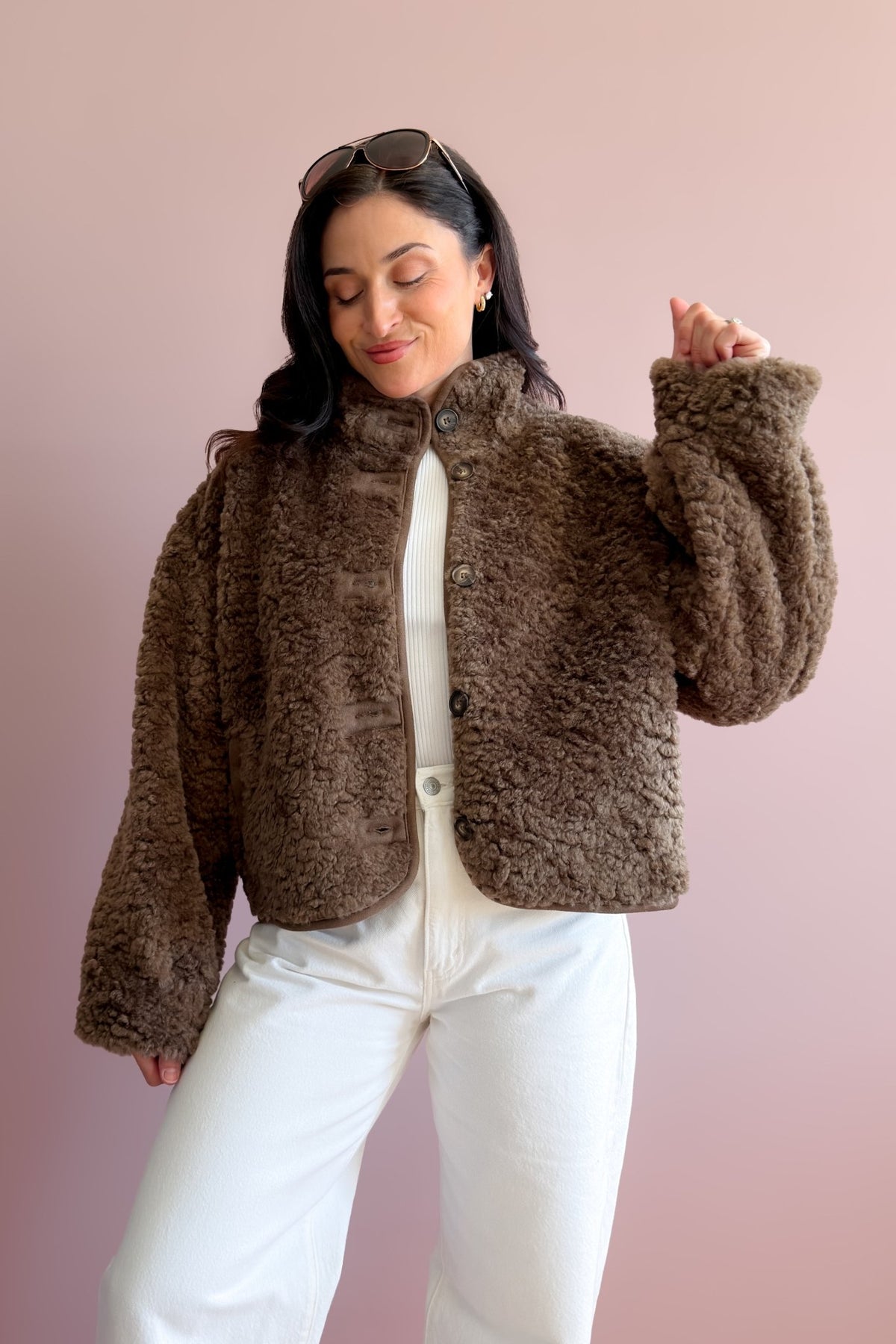 Chocolate brown sherpa fleece jacket styled with ivory denim for a neutral fall outfit