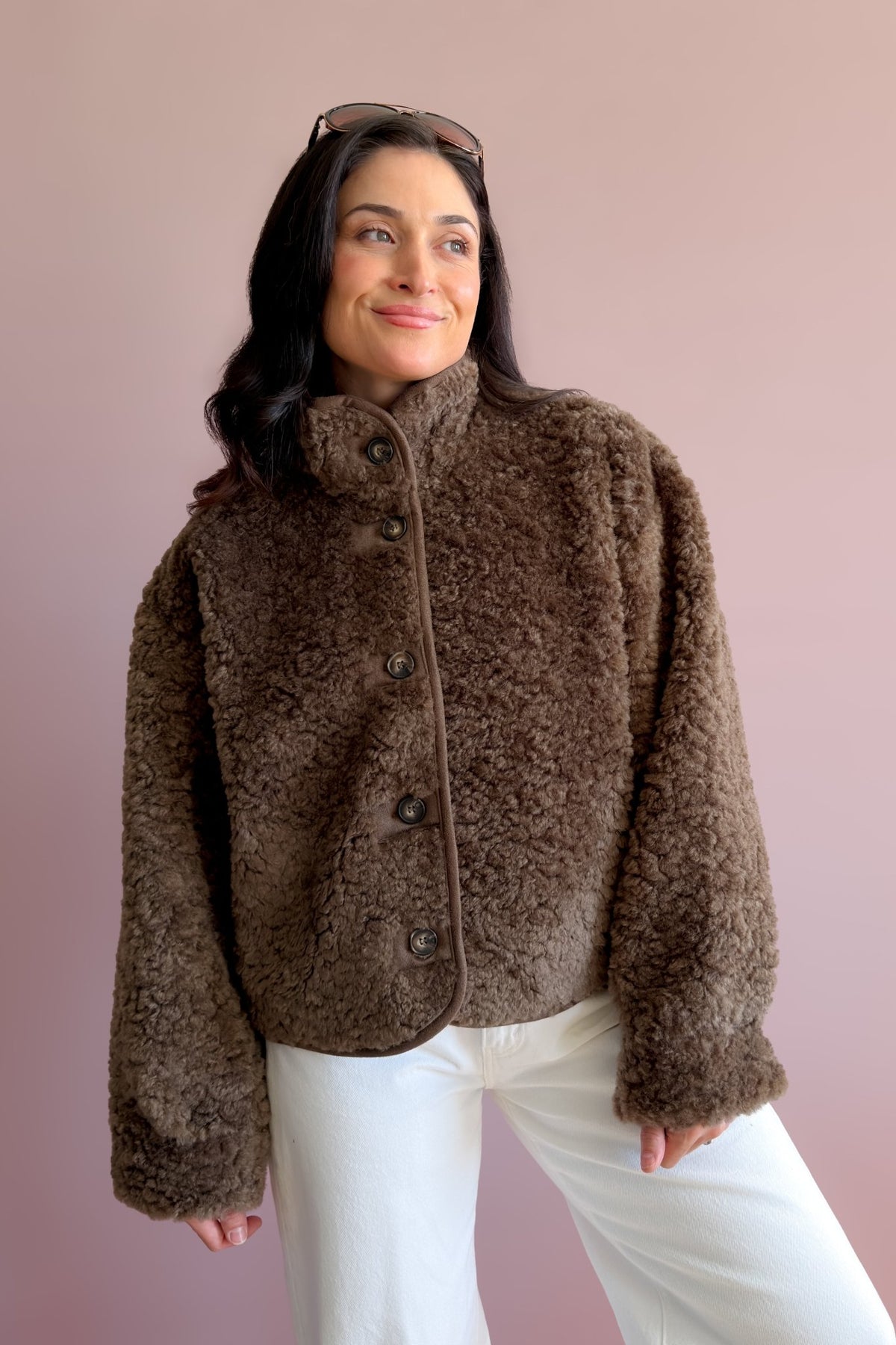 Women’s chocolate brown sherpa button-front jacket with plush texture and stand collar