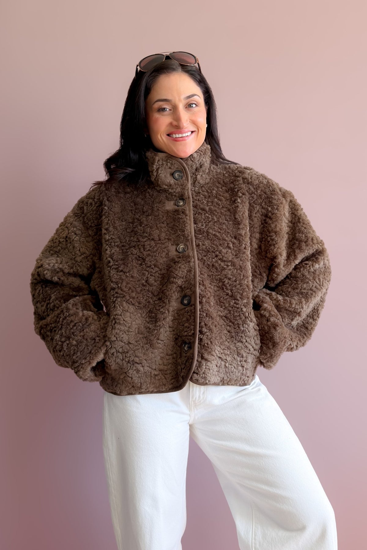 Women’s brown sherpa jacket with high collar, roomy sleeves and warm textured fleece