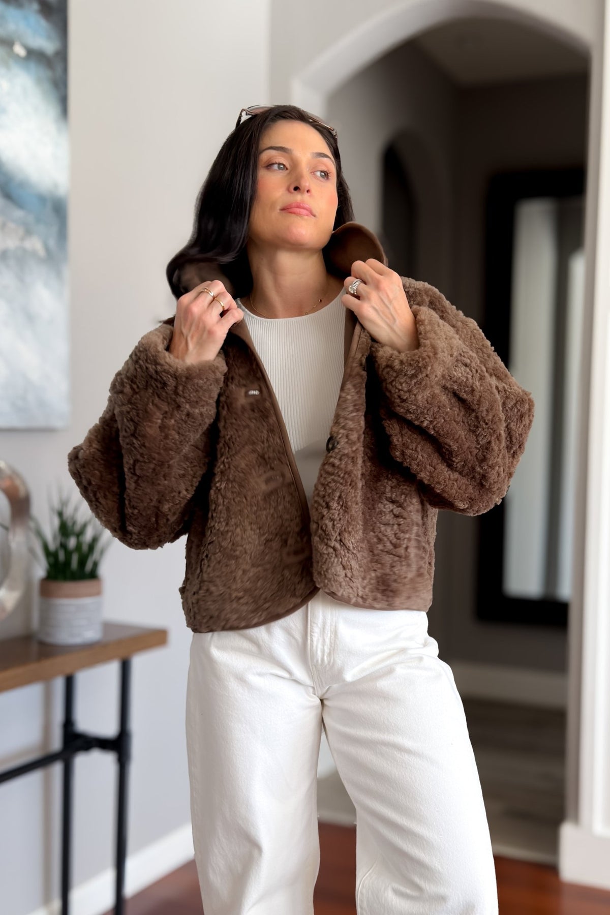 Plush brown sherpa outerwear jacket for women styled with cream denim and neutral basics