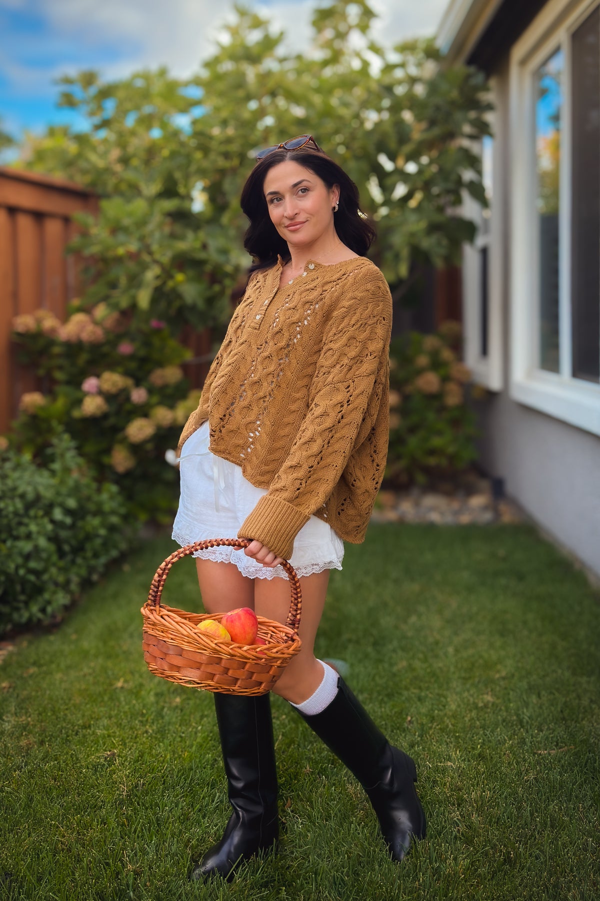 Brown oversized cable knit sweater with Henley neckline for fall layering