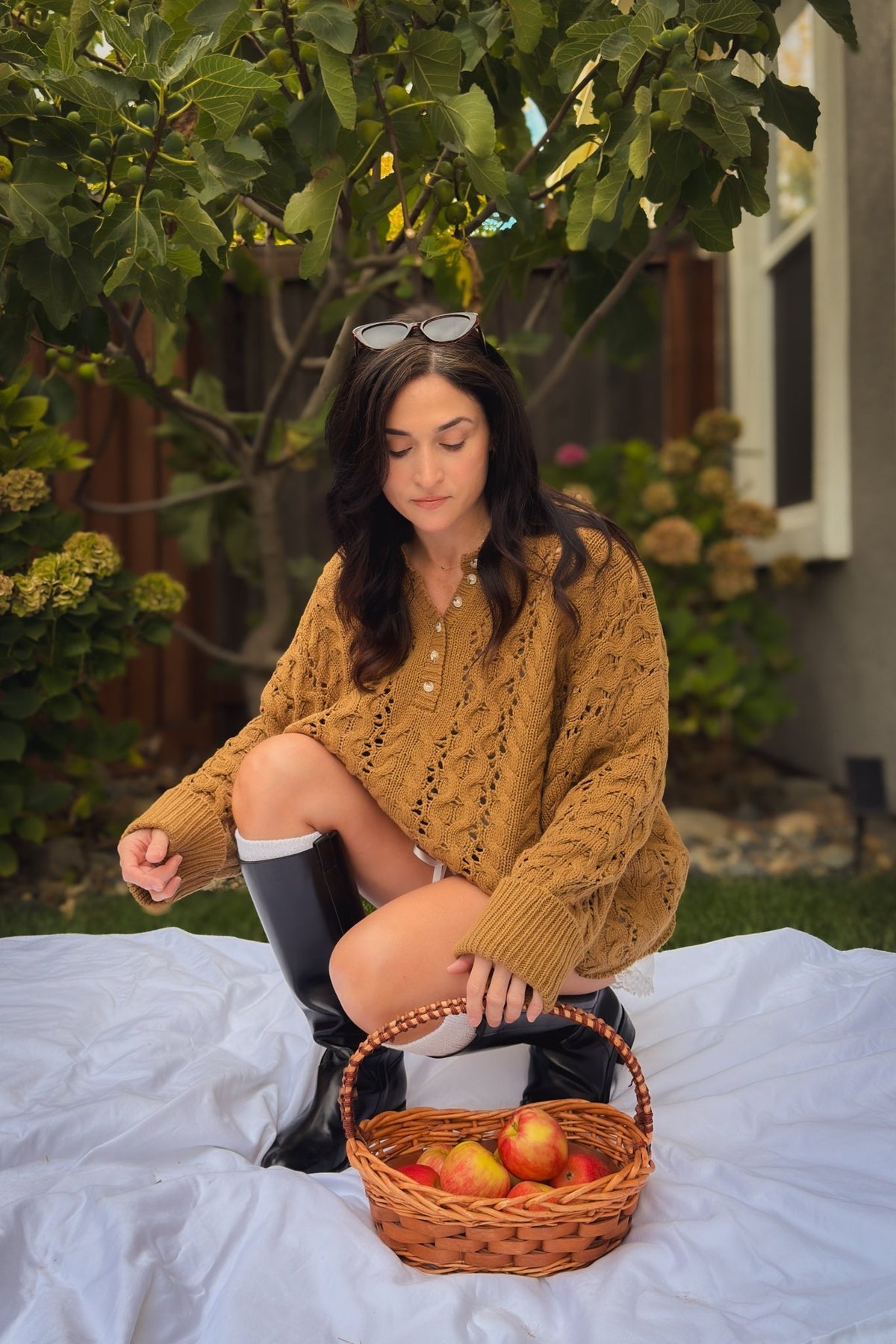 Soft oversized cable knit sweater in camel with button front neckline