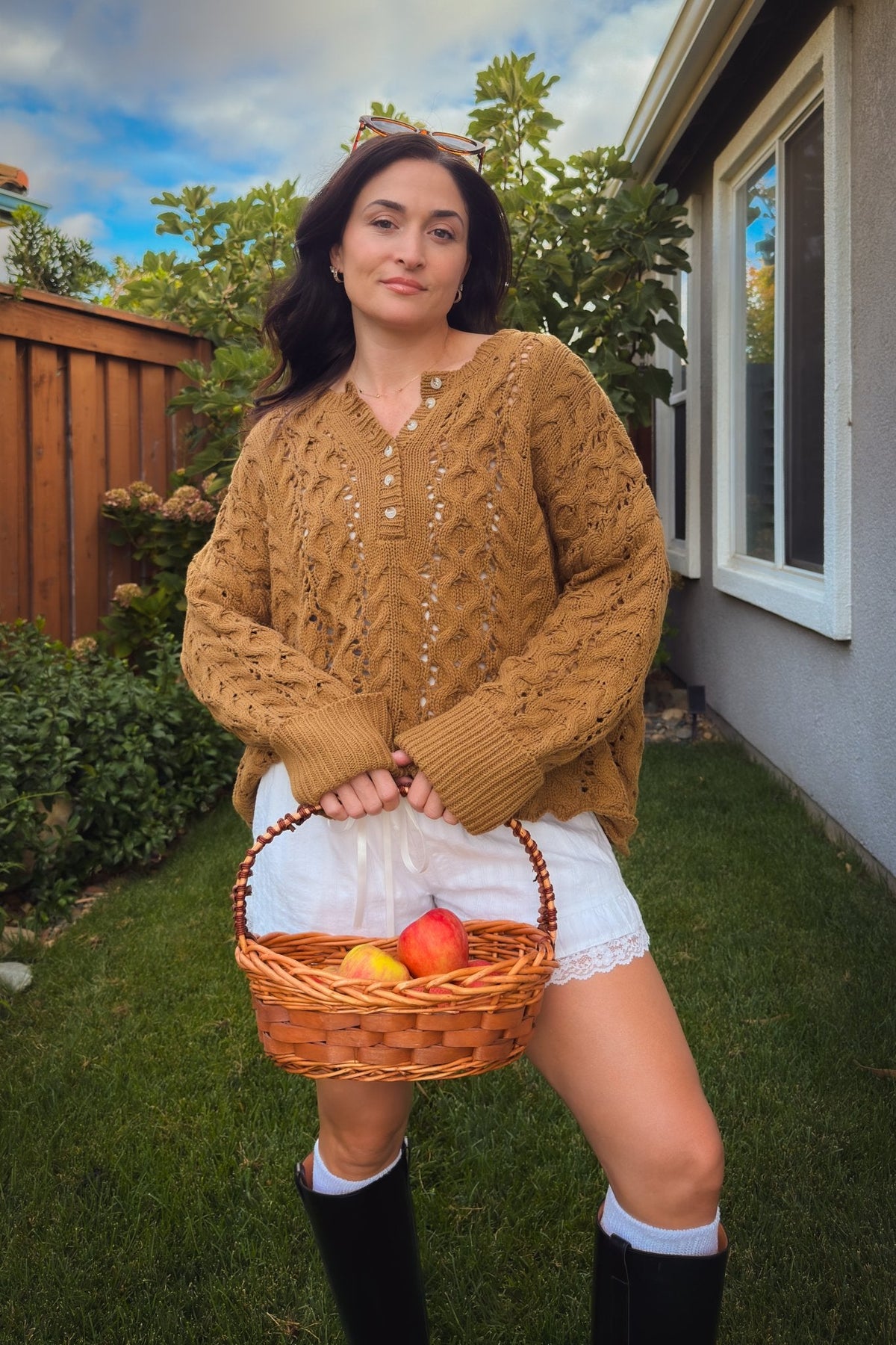 Women’s oversized brown cable knit sweater styled for a cozy fall outfit