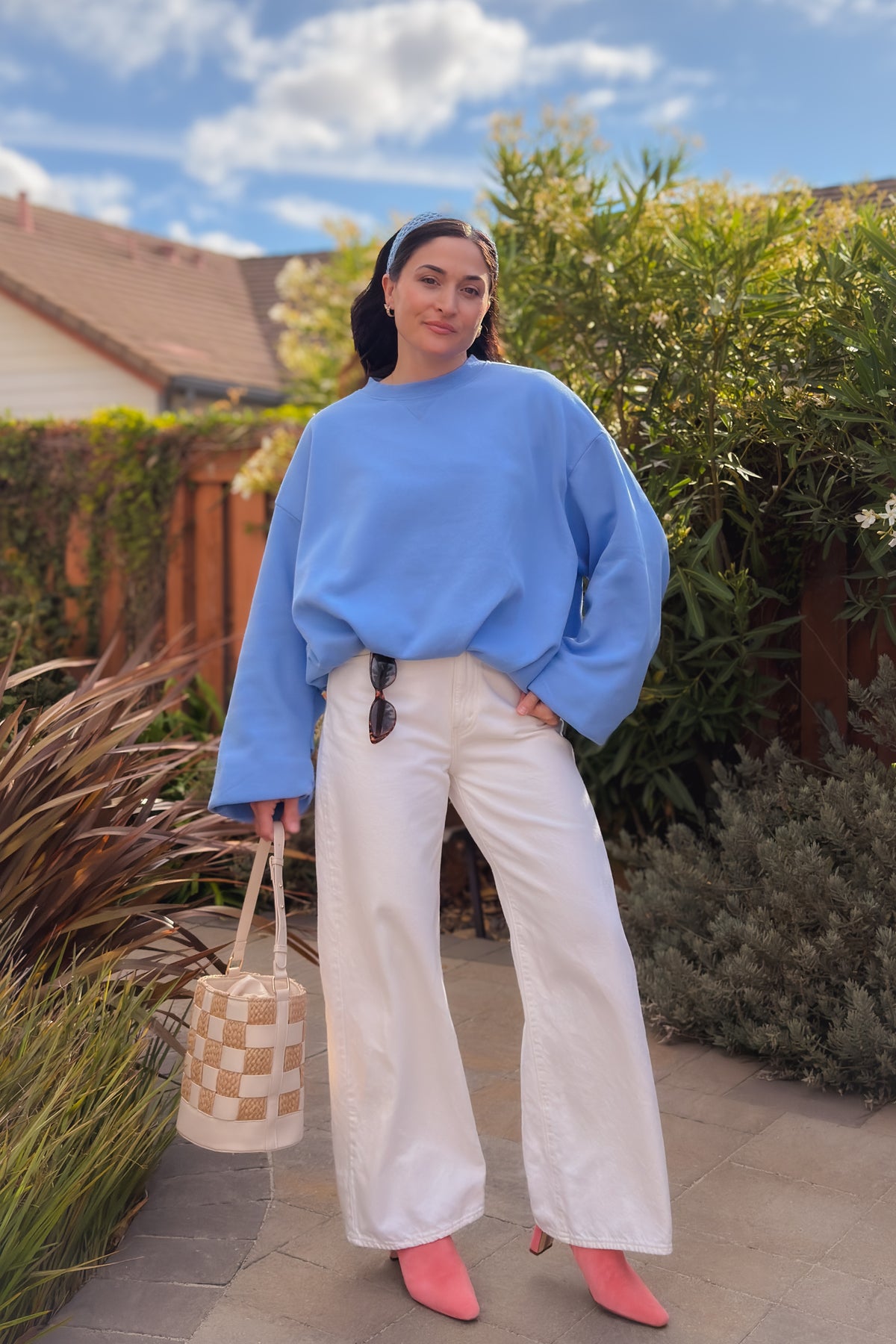 Soft cornflower blue crewneck sweatshirt styled with white jeans for a casual fall outfit