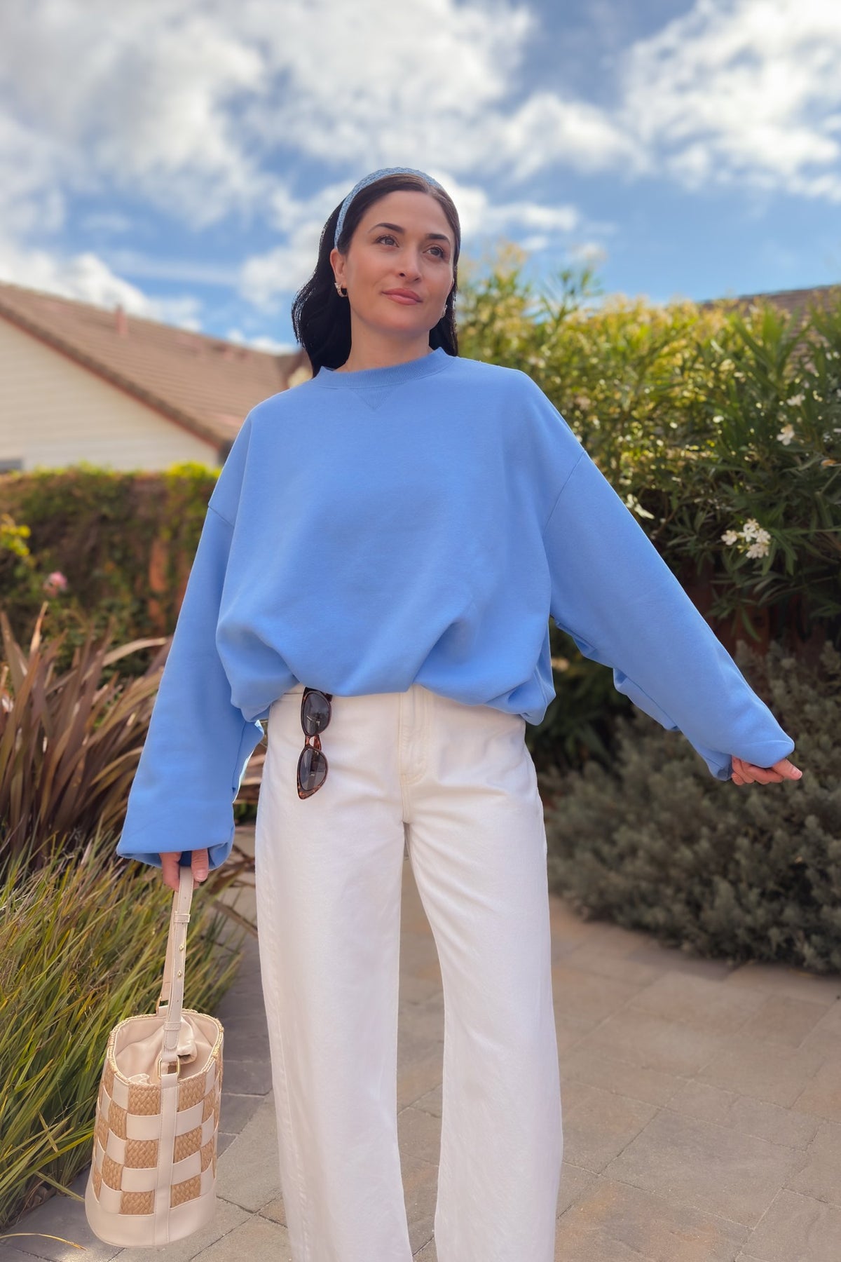 Women’s blue oversized crewneck top with drop shoulders and flexible elastic hem