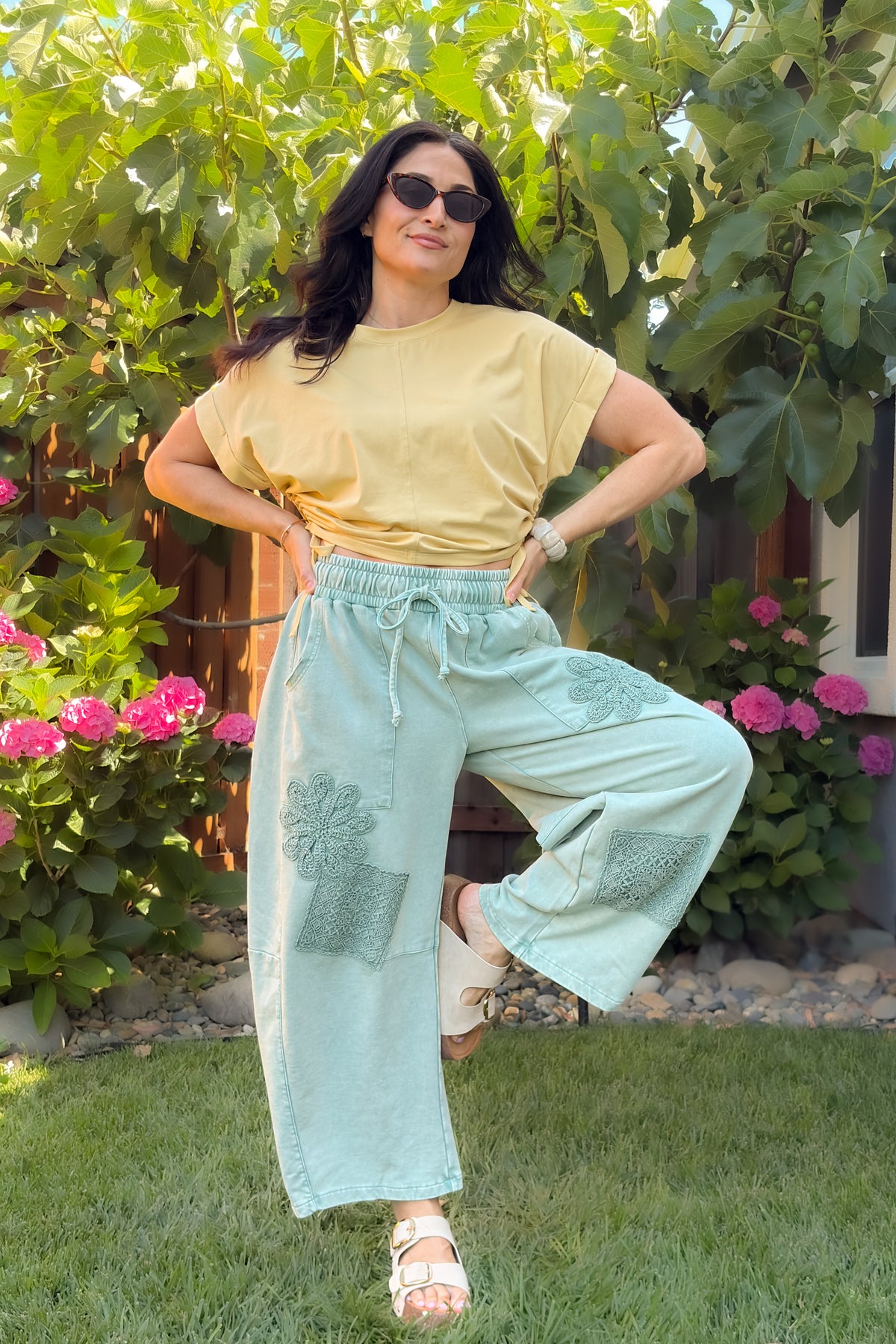Green mineral wash crochet barrel pants with a relaxed fit and comfortable stretch fabric styled for a casual summer outfit.