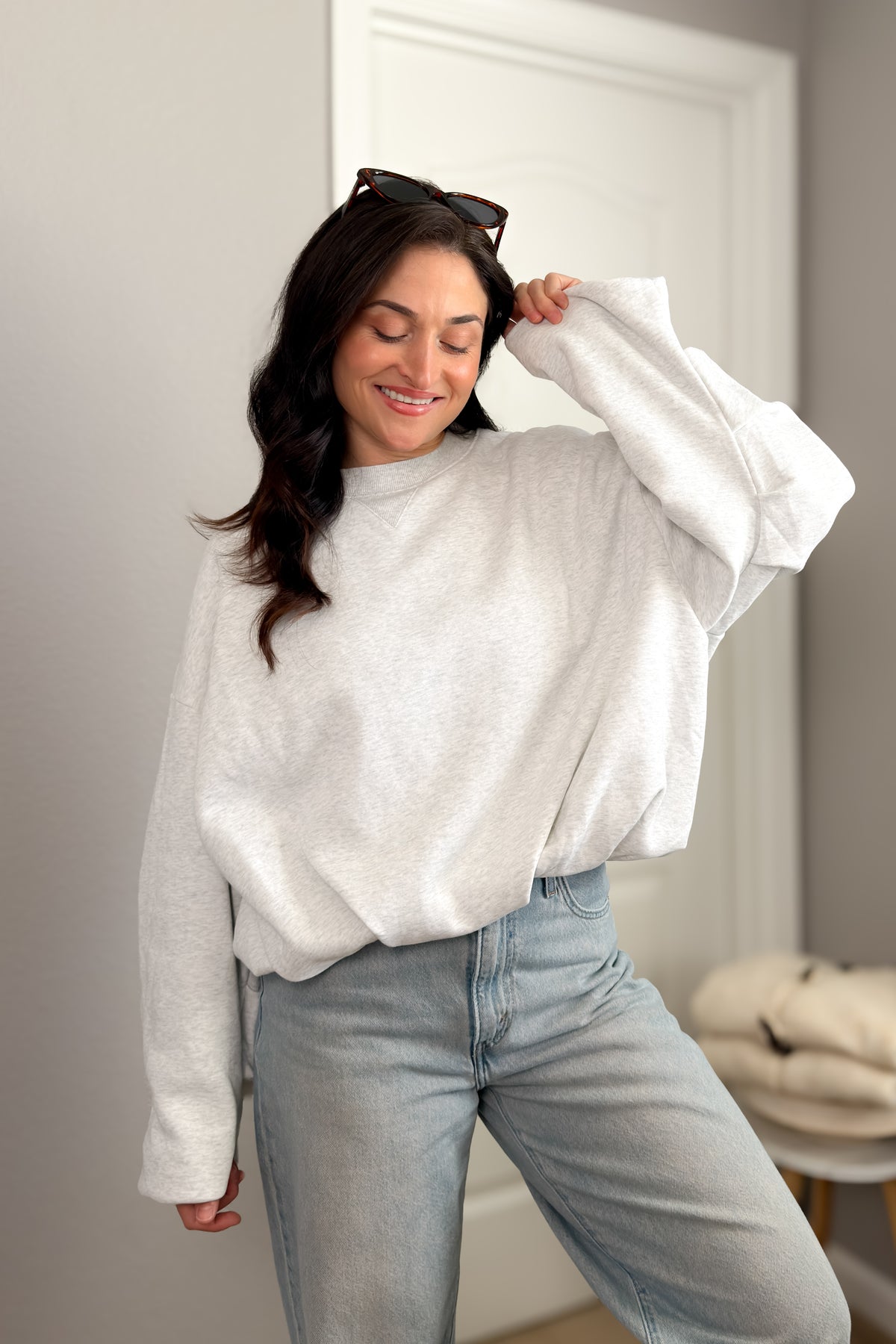 Light heather gray oversized sweatshirt for women featuring a soft crew neckline, dropped shoulders and relaxed everyday fit.