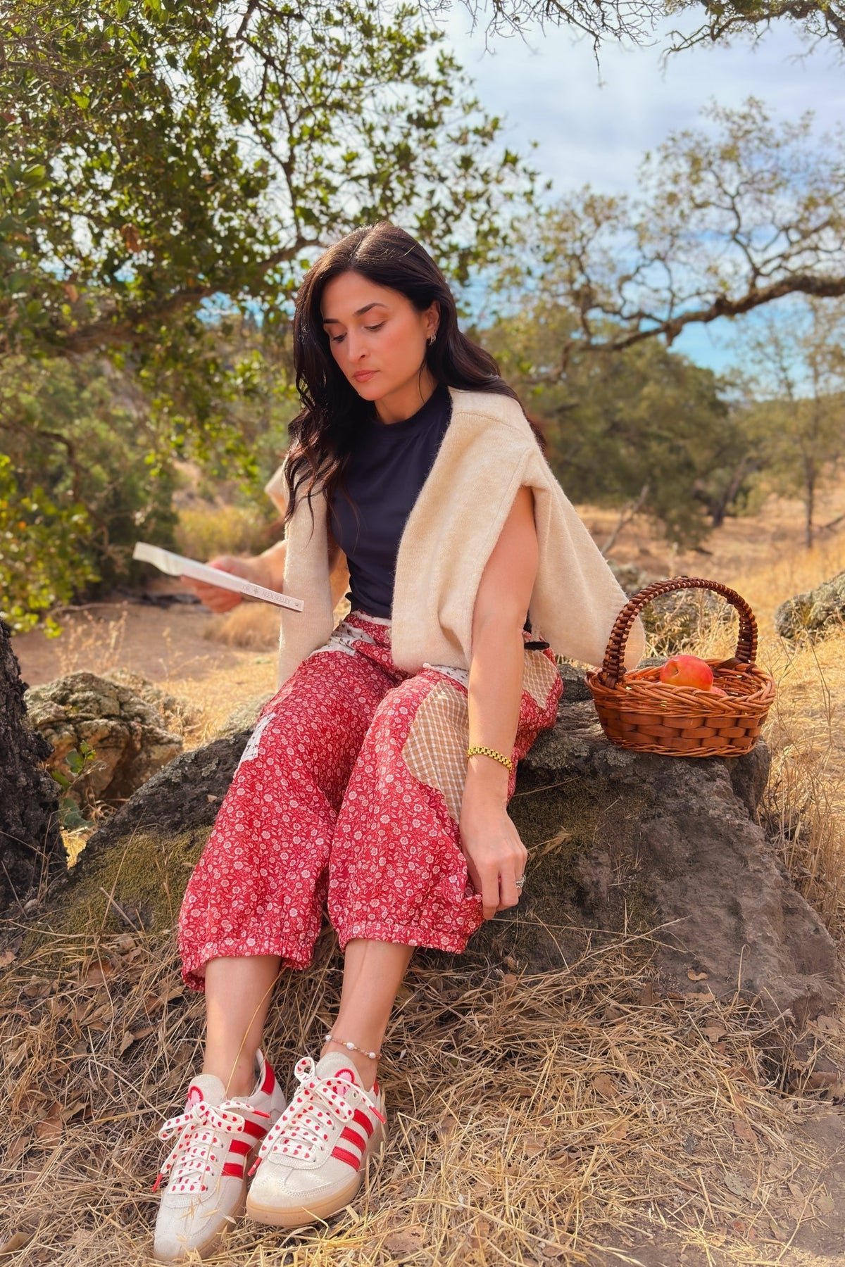 Muted red women’s statement pants with floral patchwork and relaxed balloon shape